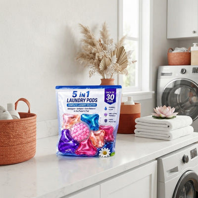 A pack of 30 five-in-one laundry pods displayed on a bright white surface with terracotta and burnt sienna decor accents.